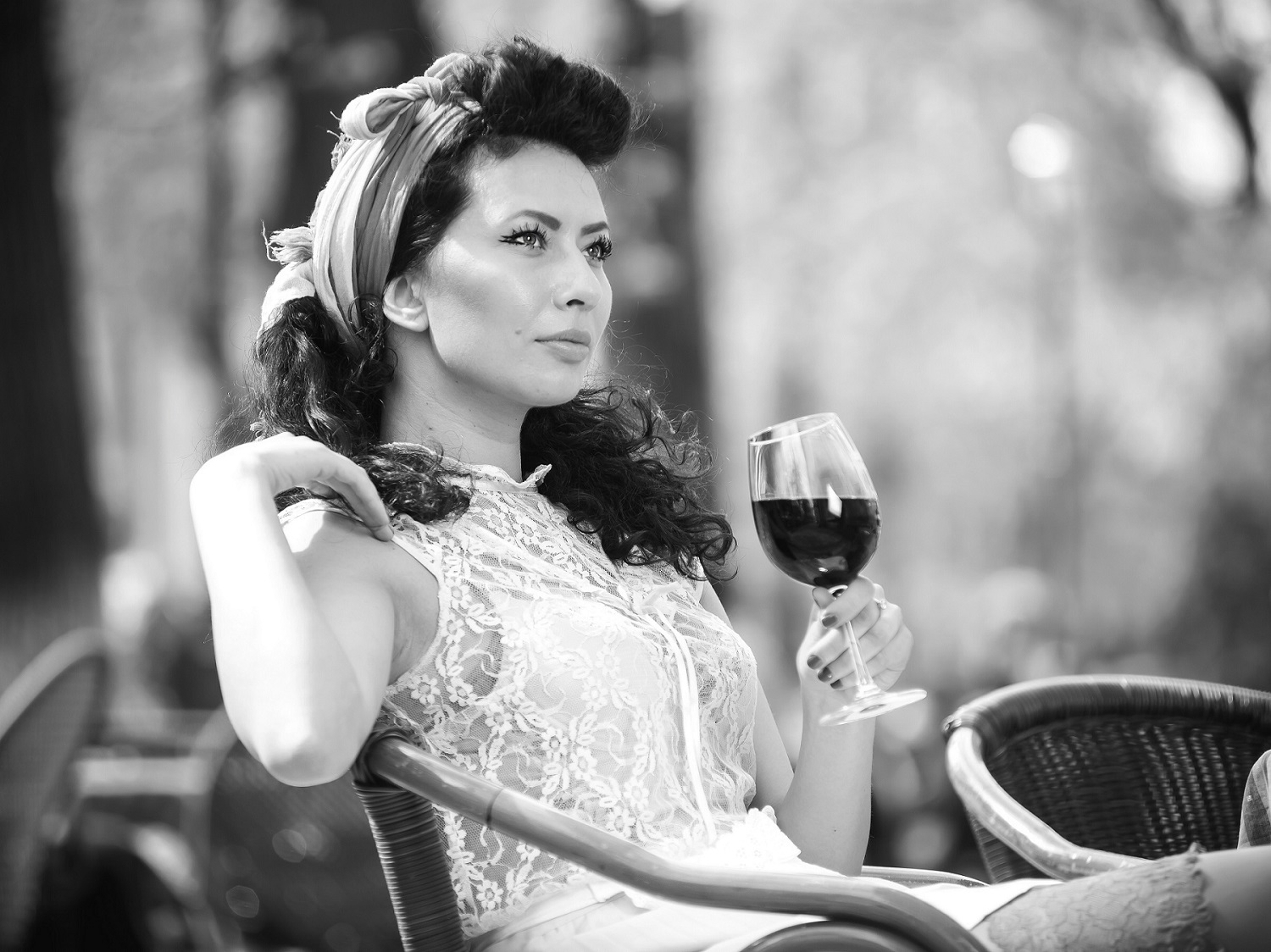 Beautiful young girl with glass of red wine pibarnon